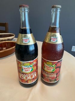 Vintage cola Canadian dry bottles and vintage Tropicana glass container