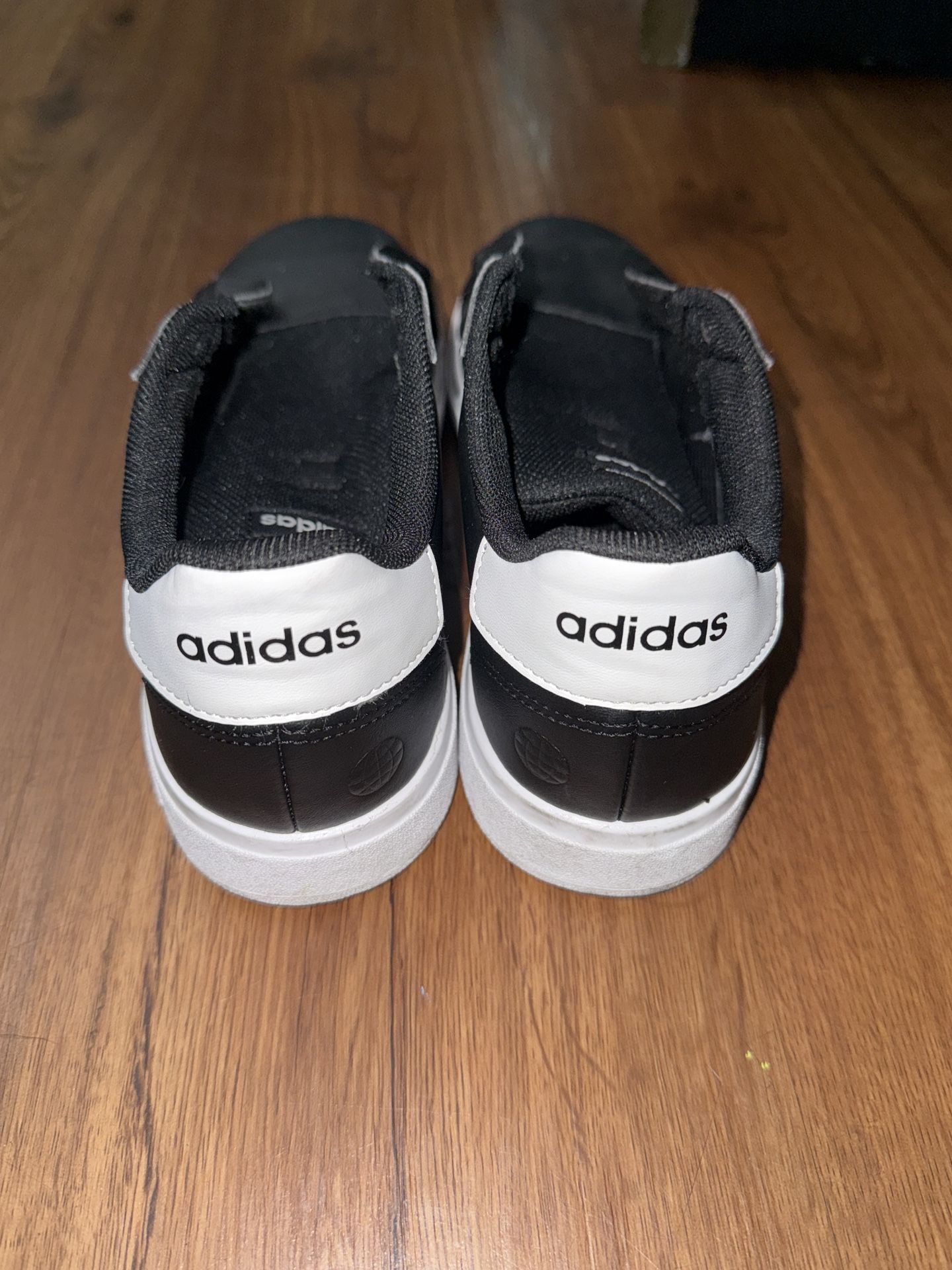 Adidas Grand Court in a black and white
