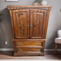 Wooden Armoire with Carved Design