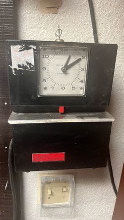 Old school time clock with the key