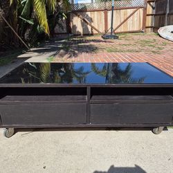 Glass top coffee table on wheels