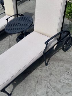 Two Ballard Design Almafi Chaise patio and pool lounge chairs with matching umbrella table