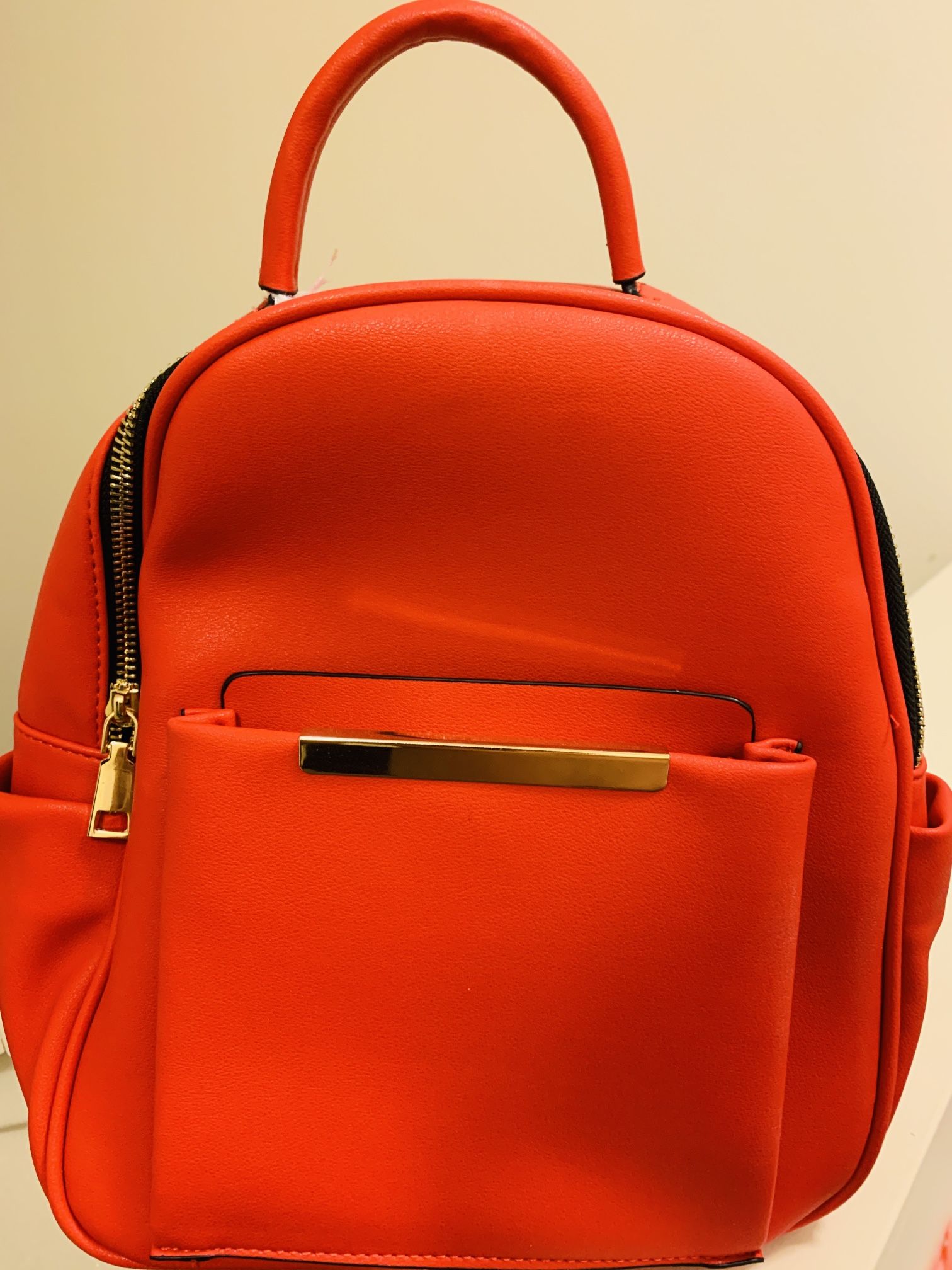 small red women's backpack