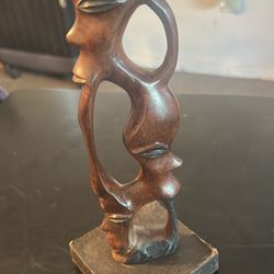 This item is a vintage, hand-carved wooden abstract sculpture,