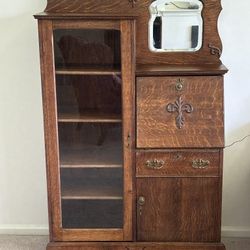 Vintage Antique Side-By-Side Tiger Oak Secretary Desk, with glass front bookcase and 6 total shelves, drop front desk writing surface,  mirrored secti