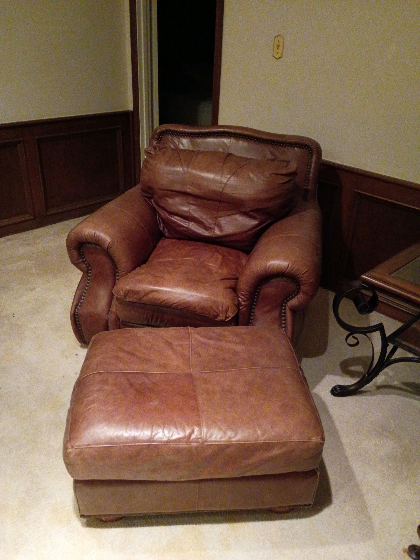 Head oversized stuffed easy chair with ottoman and an oversized leather stuffed sofa