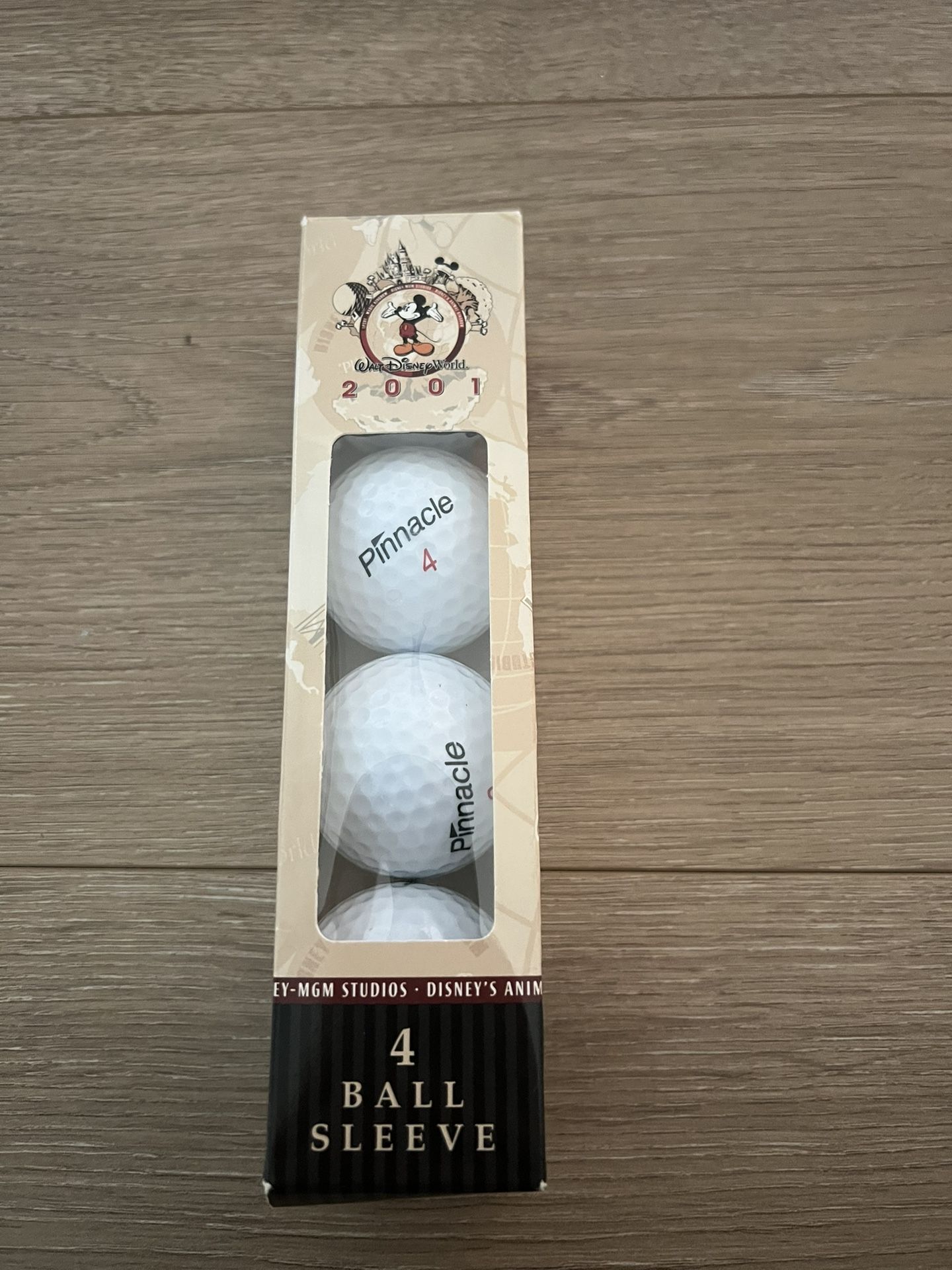 4 Disney Parks 2001 Collectible Golf Balls - never used. Each ball has logo of different park - magic kingdom, animal kingdom, etc