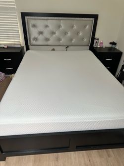A queen bed mattress with cover