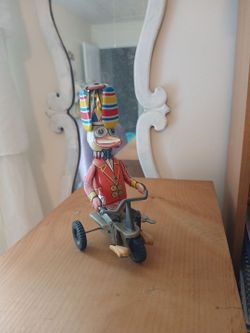 Vintage wind-up duck on a bike