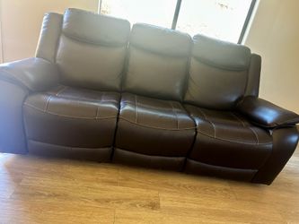 Brown leather power reclining sofa