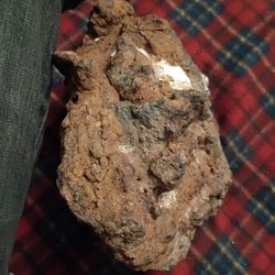 Have What I Think Is A Meteorite, It's Red With Some Kind Of Blk, Green And Red, Poking Out. It's Magnetic A Very Cool Rockabout The Size Of A Small V