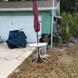 Umbrella And Small Metal Table
