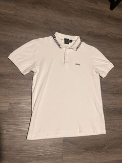 White boss polo size S has a small stain