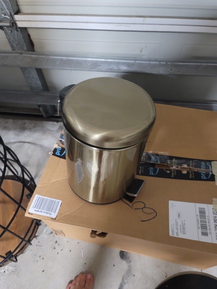 Gold lamp and trash can