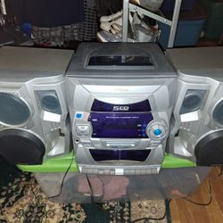 Audiovox CE-448 Compact Stereo SystemFeatures a 5-disc CD changer.
Includes a dual cassette deck with auto-stop Equipped with an AM/FM tuner Comes wit