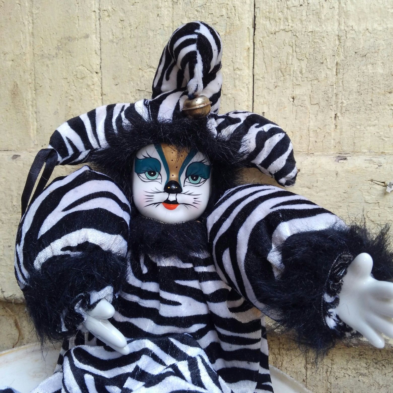 Vintage cat porcelain Jester doll in fair condition