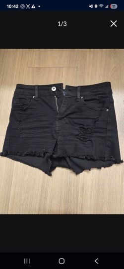 Woman's black ripped shorts