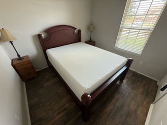 Queen-size bed with a clean mattress.