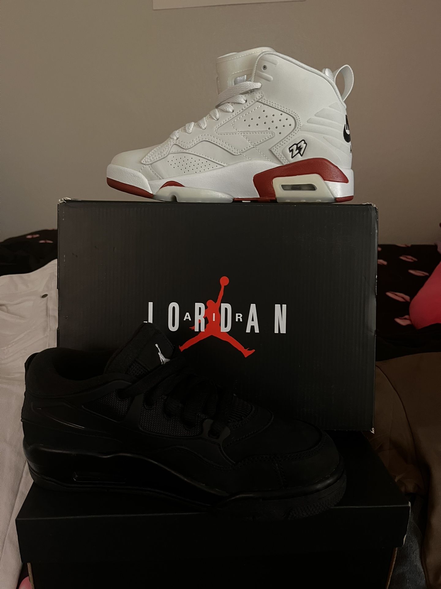 2 Pair Of Jordan’s And A Spray Ground Bag