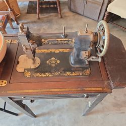 Antique Sewing Machine In cabinet