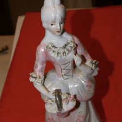 Victorian porcelain lady statue about 8 inches tall