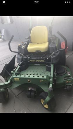 John deer mowing tractor