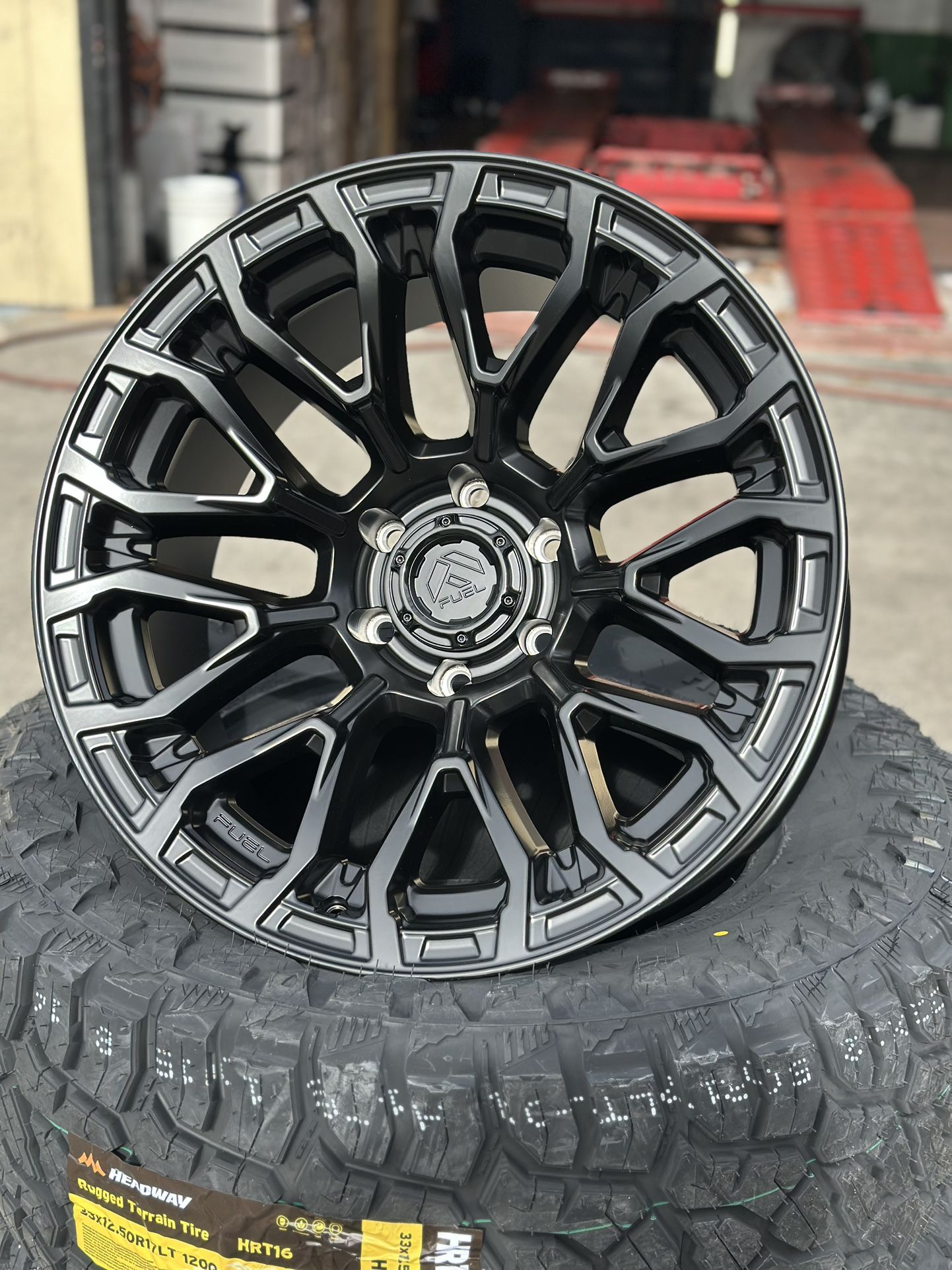 Fuel FC899 chisel 20x10 6x139.7 -18 black with 33x12.50r20 mud tires available in stock we finance