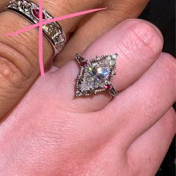 10k White gold marquis engagement ring with ruby side stones