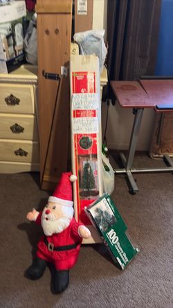 4ft Artificial Christmas Tree with Stand, Stuff Santa and New 100 clear lights all together for $12.00