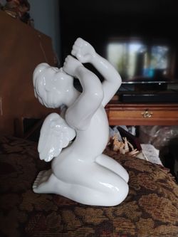 White glazed porcelain cherub