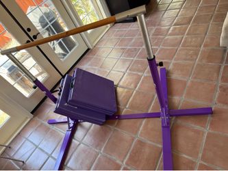 Kids gymnastics bar and mats