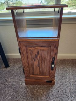 Nice wooden bedside nightstand.