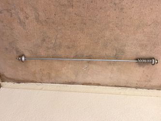 2 gold and silver curtain rods with rings