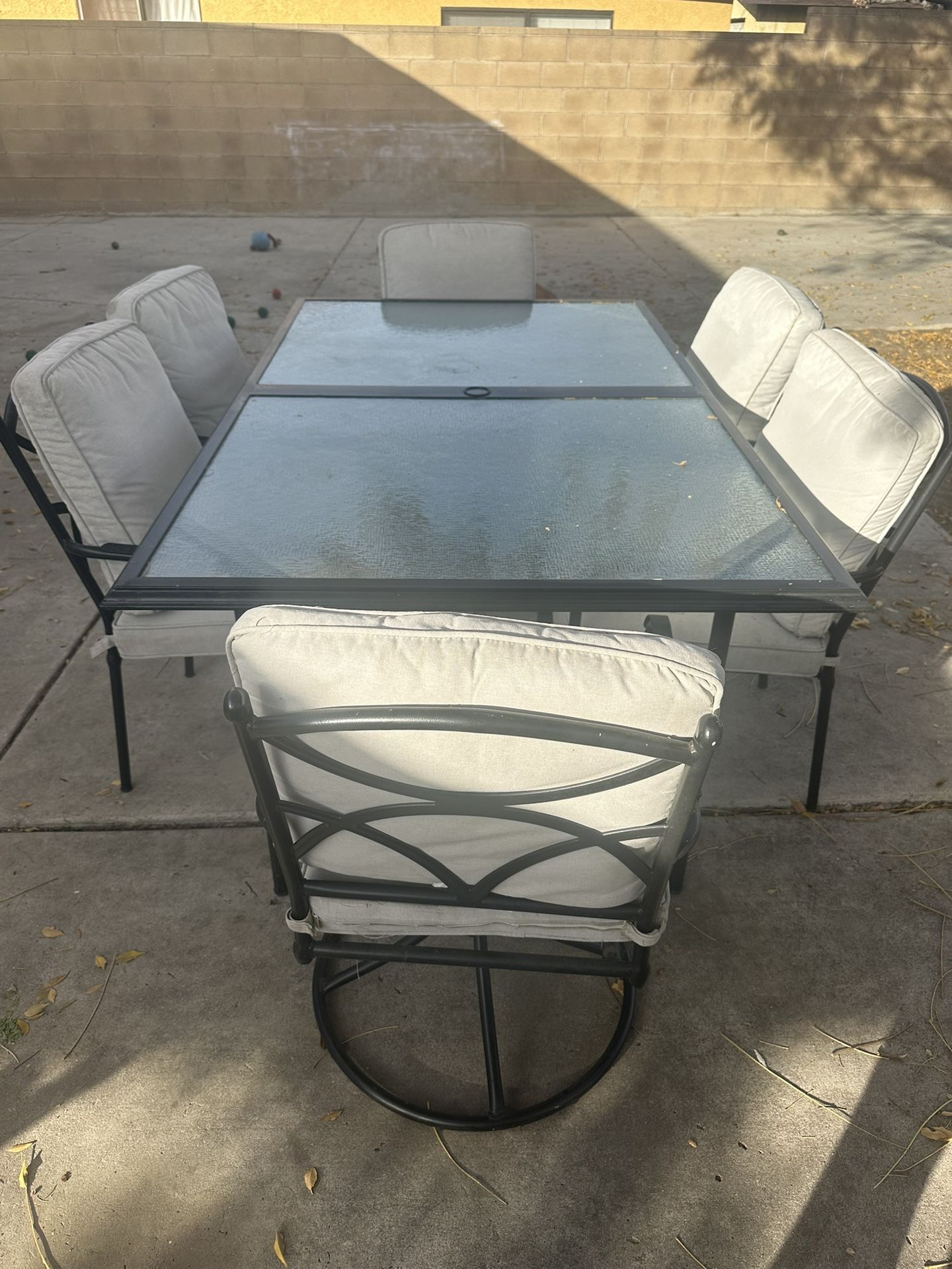 Glass Top Patio Set with Six Cushioned Chairs