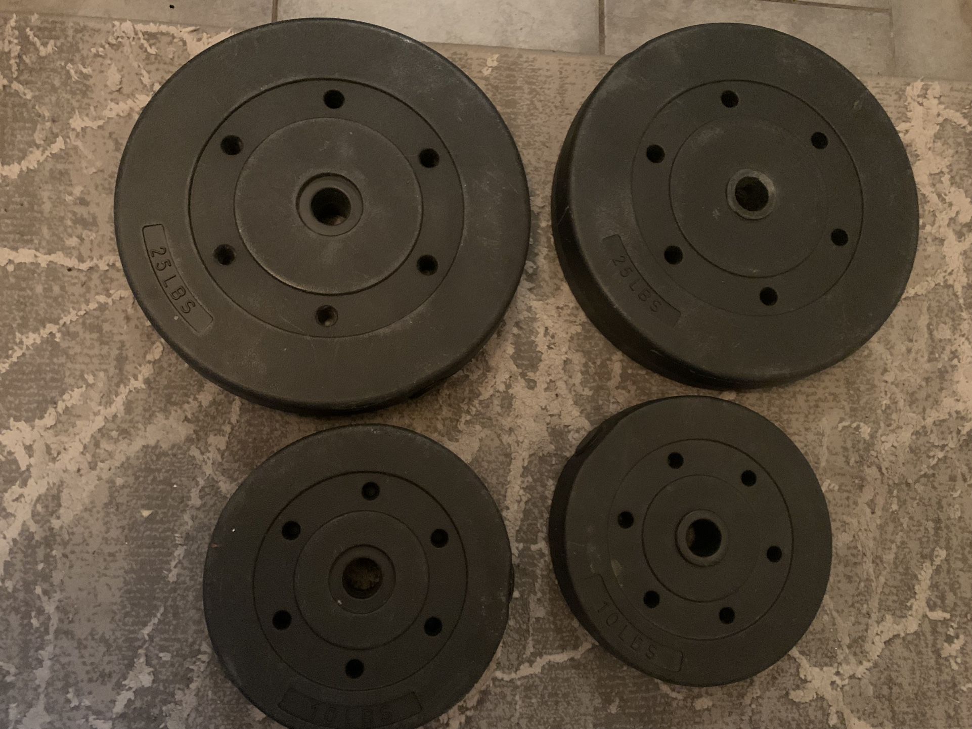 Two 25 Lb Standard 1” Vinyl Weight Plates - plus two 10 lb plates 