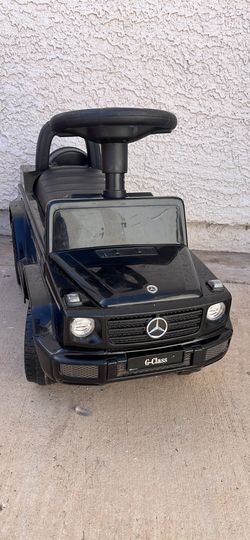 Ride-on and push G-wagon with storage compartment