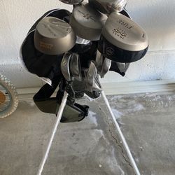 Complete set of golf clubs with stand bag.