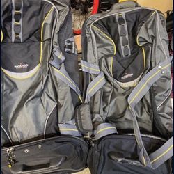 3 Luggage Bags And 2 Blue Carry Ons