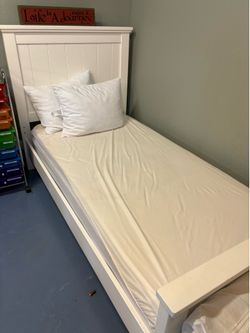 Two twin size beds with mattresses