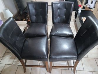 Four kitchen chairs.