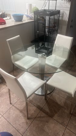Comedor de cristal redondo 4 sillas