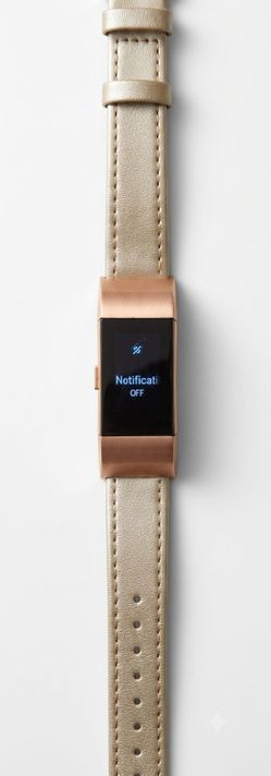 Fitbit charge 2 with a leather and metal mesh band tracks sleep, heart rate exercise and fitness smartwatch tracker