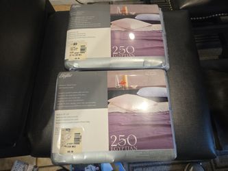 Two, unopened queen sized flat sheet packages