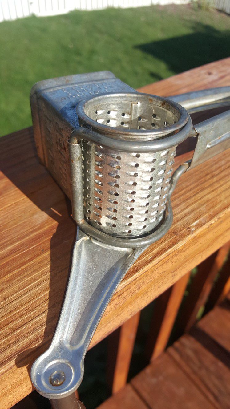 Vintage Mouli cheese grater made of steel with old wooden handle