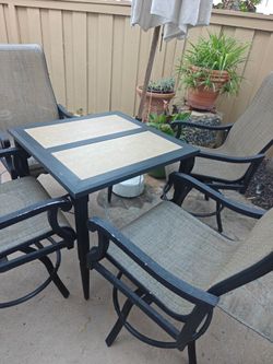 ​FREE Outdoor Bar-Height Patio Set - Tile Top Table & 4 Swivel Chairs