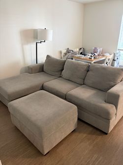 Sofa with reversible chaise and storage ottoman