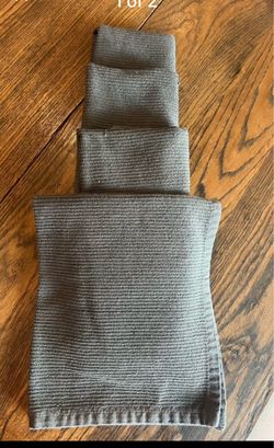 Four gray ribbed cloth napkins