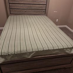 Queen bed with box spring. Mattress is free.