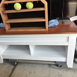  wooden console table or TV stand featuring a dark wood top and a white painted base