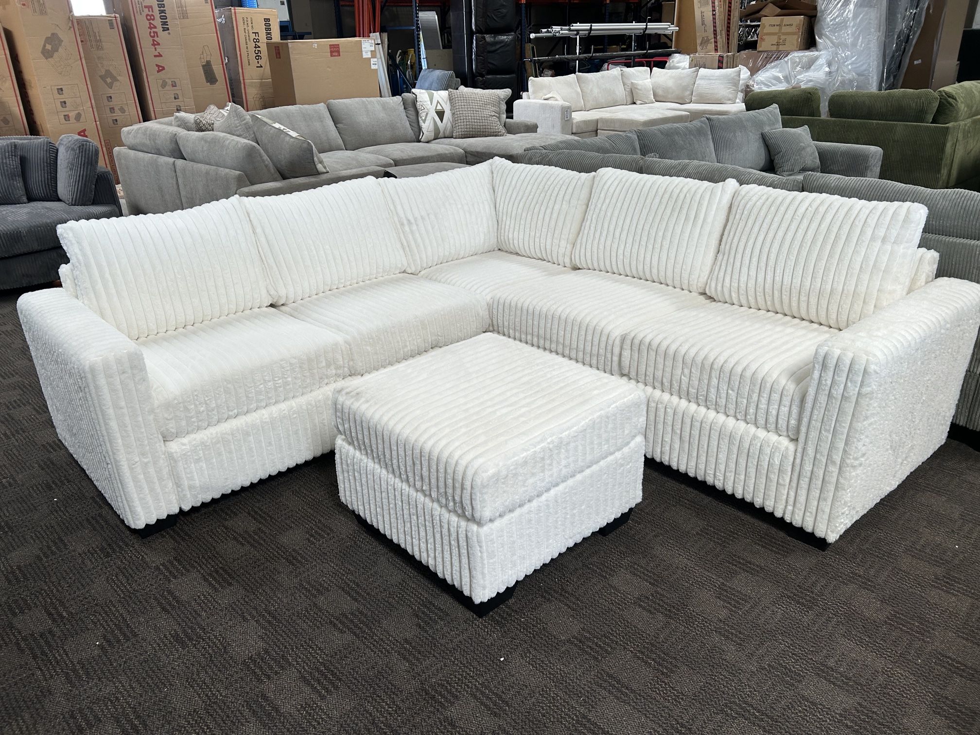 White Corduroy Sectional And Ottoman